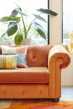 DFS Belair three-seater sofa bed in orange sensual velvet