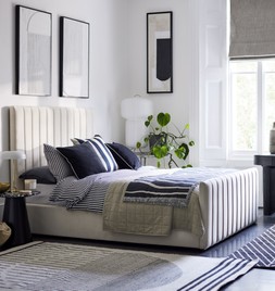DFS Bryony King Size Ottoman Bed Frame in Cream Velvet, Dwell Zya Accent Chair, Dwell Alcina Terrazzo Lamp Table, available at DFS, Dwell Lerato Artwork, available at DFS