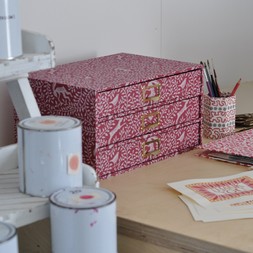 A Flight of Dancing Hare Patterned Paper-Covered Collector's Drawers