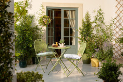 Lisbon Bistro Set Green £99 & Sintra Glazed Terracotta Oil Drizzler Ochre £5.99.