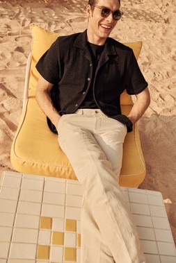 M&S CROCHET SHIRT £40, AUTOGRAPH BLACK T-SHIRT £20, LINEN TROUSERS £40, SUNGLASSES £18